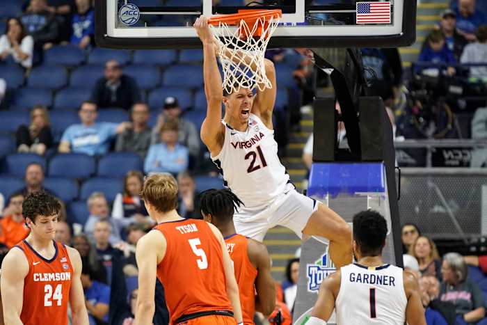 Virginia forward Kadin Shedrick reacts after dunking against Clemson